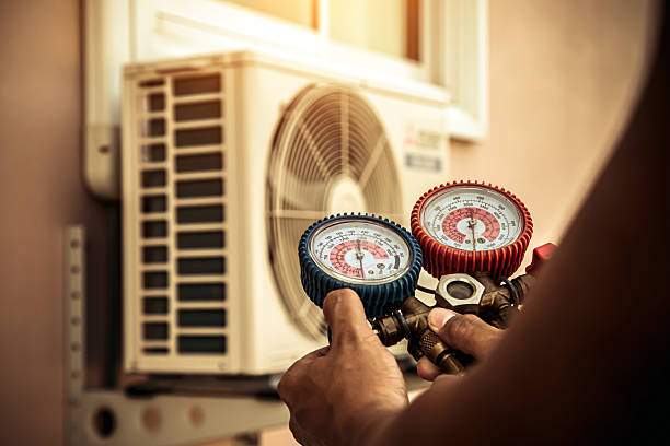 Professional Heat Pump Repair technician working in Donald, OR